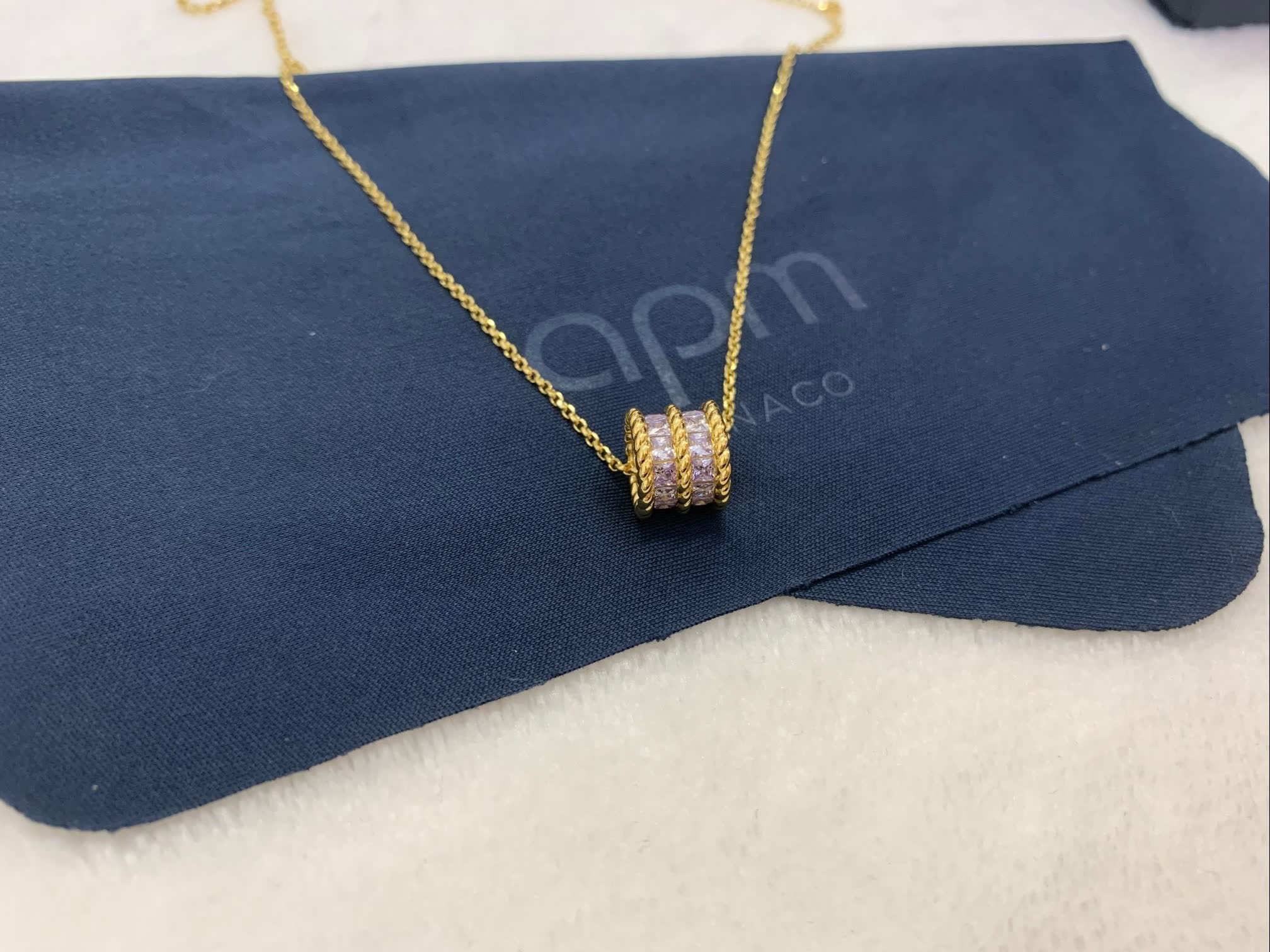 APM Monaco Gold Heart-Shaped Necklace with Purple Stones